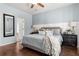 Comfortable bedroom with a ceiling fan, hardwood floors, and large windows at 3133 Cold Harbor Way, Charleston, SC 29414
