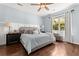 Bright bedroom with a ceiling fan, hardwood floors, natural light, and stylish furnishings at 3133 Cold Harbor Way, Charleston, SC 29414