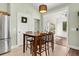 Cozy dining area with a wooden table and chairs, located adjacent to the kitchen and offering backyard views at 3133 Cold Harbor Way, Charleston, SC 29414