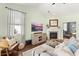 Comfortable living room featuring a fireplace, modern entertainment setup, and neutral color scheme at 3133 Cold Harbor Way, Charleston, SC 29414