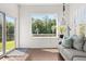 Bright sunroom with access to the outside deck, hardwood floors, and neutral decor at 3133 Cold Harbor Way, Charleston, SC 29414
