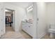Bright bathroom featuring a double vanity with granite countertop and a closet view at 3149 Timberline Dr, Johns Island, SC 29455