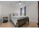 Inviting bedroom with a comfy bed, ceiling fan, and large windows overlooking a green space at 3149 Timberline Dr, Johns Island, SC 29455