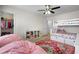 Bright bedroom with colorful accents, a bunk bed, and ample closet space at 3149 Timberline Dr, Johns Island, SC 29455