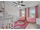 Charming bedroom with a playful rug, bunk bed, and ceiling fan at 3149 Timberline Dr, Johns Island, SC 29455