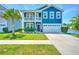 Charming two-story home features a balcony, well-manicured lawn, and waterfront views with a two car garage at 3149 Timberline Dr, Johns Island, SC 29455