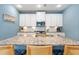 Well-equipped kitchen with granite countertops, white cabinets, and modern stainless steel appliances at 3149 Timberline Dr, Johns Island, SC 29455