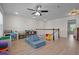 Spacious playroom with light hardwood floors, ceiling fan, and lots of natural light at 3149 Timberline Dr, Johns Island, SC 29455