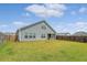 A sprawling backyard showcasing the rear of the home with a covered patio at 317 Fiddleback Dr, Summerville, SC 29486