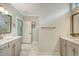 Spacious bathroom showing dual vanities, tile floor, and walk in shower at 317 Fiddleback Dr, Summerville, SC 29486