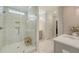 Bright bathroom features glass shower, tiled floor, and large vanity at 317 Fiddleback Dr, Summerville, SC 29486