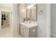Bathroom features single vanity, large mirror, tiled floor, and walk in closet at 317 Fiddleback Dr, Summerville, SC 29486