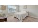 Bright bedroom features a comfortable bed, large window and neutral decor at 317 Fiddleback Dr, Summerville, SC 29486