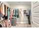 Walk-in closet with metal shelving full of clothing and luggage at 317 Fiddleback Dr, Summerville, SC 29486