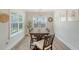 Bright dining room with a large wooden table, six chairs, and lots of natural light at 317 Fiddleback Dr, Summerville, SC 29486