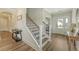 Inviting entryway with wood floors features a staircase and decorative furnishings at 317 Fiddleback Dr, Summerville, SC 29486