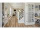 Bright foyer with hardwood floors leading to an open-concept living area and staircase at 317 Fiddleback Dr, Summerville, SC 29486