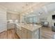 Spacious kitchen with an island overlooking the living room, with stylish pendant lighting at 317 Fiddleback Dr, Summerville, SC 29486