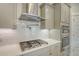 Modern kitchen features stainless steel range hood, gas cooktop, and built in oven at 317 Fiddleback Dr, Summerville, SC 29486