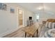 Cozy living room with wood floors offers comfortable seating and a view into bathroom at 317 Fiddleback Dr, Summerville, SC 29486