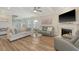 Cozy living room with a fireplace, hardwood floors, and comfortable seating for relaxing and entertaining at 317 Fiddleback Dr, Summerville, SC 29486