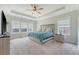Spacious main bedroom features tray ceiling, carpet and ample natural light at 317 Fiddleback Dr, Summerville, SC 29486