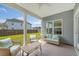Cozy covered patio featuring comfortable seating and a view of the backyard at 317 Fiddleback Dr, Summerville, SC 29486