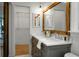 Bright and airy bathroom features a dual sink vanity and large framed mirror at 32 Heathwood Dr, Charleston, SC 29407