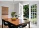 Dining area featuring a view to a spacious outdoor patio and backyard at 32 Heathwood Dr, Charleston, SC 29407