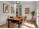 Inviting dining room with a classic wooden table and artistic decor elements at 32 Heathwood Dr, Charleston, SC 29407