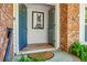 Inviting front entrance with a pop of color, a peek at the interior decor, and potted plants at 32 Heathwood Dr, Charleston, SC 29407