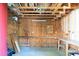 Unfinished garage with exposed framing and built-in shelving, offering ample storage space at 32 Heathwood Dr, Charleston, SC 29407