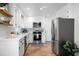 Stylish kitchen with stainless steel appliances, white cabinetry, and a bright, airy feel at 32 Heathwood Dr, Charleston, SC 29407