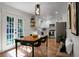 Charming kitchen and dining area boasting natural light, stainless steel appliances, and tiled floors at 32 Heathwood Dr, Charleston, SC 29407