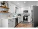 Modern kitchen with white cabinets, stainless steel appliances, and white subway tile backsplash at 32 Heathwood Dr, Charleston, SC 29407