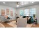 Bright living room featuring hardwood floors, a comfortable sofa, and stylish decor at 32 Heathwood Dr, Charleston, SC 29407