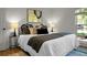 Serene main bedroom featuring a plush bed, side tables with lamps, and plenty of natural light at 32 Heathwood Dr, Charleston, SC 29407