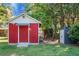 Exterior shot of outbuilding with red paint and white trim at 32 Heathwood Dr, Charleston, SC 29407