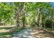 Scenic park pathway lined with lush trees and greenery at 32 Heathwood Dr, Charleston, SC 29407