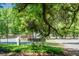 LENEVAR Playground sign near a green tennis court and lush trees at 32 Heathwood Dr, Charleston, SC 29407