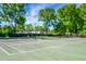 Well-maintained tennis courts surrounded by lush trees, offering a recreational amenity at 32 Heathwood Dr, Charleston, SC 29407