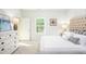 Bright bedroom with a large bed, dresser, and a window providing natural light at 323 Pine Crest View Dr, Summerville, SC 29486