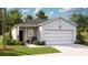 Charming single-Gathering home with a well-manicured lawn, classic siding and a two car garage at 323 Pine Crest View Dr, Summerville, SC 29486