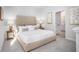Well-lit bedroom with a large bed, carpeted flooring, and neutral decor at 323 Pine Crest View Dr, Summerville, SC 29486