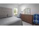 Bedroom featuring neutral decor, a wooden dresser, and a window with a backyard view at 327 Pine Crest View Dr, Summerville, SC 29486