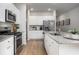 Bright kitchen with stainless steel appliances, granite countertops, and white cabinets at 327 Pine Crest View Dr, Summerville, SC 29486