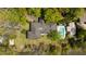 Aerial view of home with pool, fire pit and lush landscaping, creating a private and relaxing outdoor space at 333 W Confederate Cir, Charleston, SC 29407