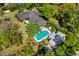 Aerial view of estate featuring a pool, guest house, lush landscaping and a spacious backyard at 333 W Confederate Cir, Charleston, SC 29407