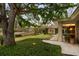 Picturesque backyard with lush greenery, a sprawling lawn, and mature trees, creating a serene and private outdoor space at 333 W Confederate Cir, Charleston, SC 29407