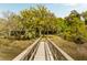Exterior shot displaying wooden walkway leading to home from private boat dock at 333 W Confederate Cir, Charleston, SC 29407
